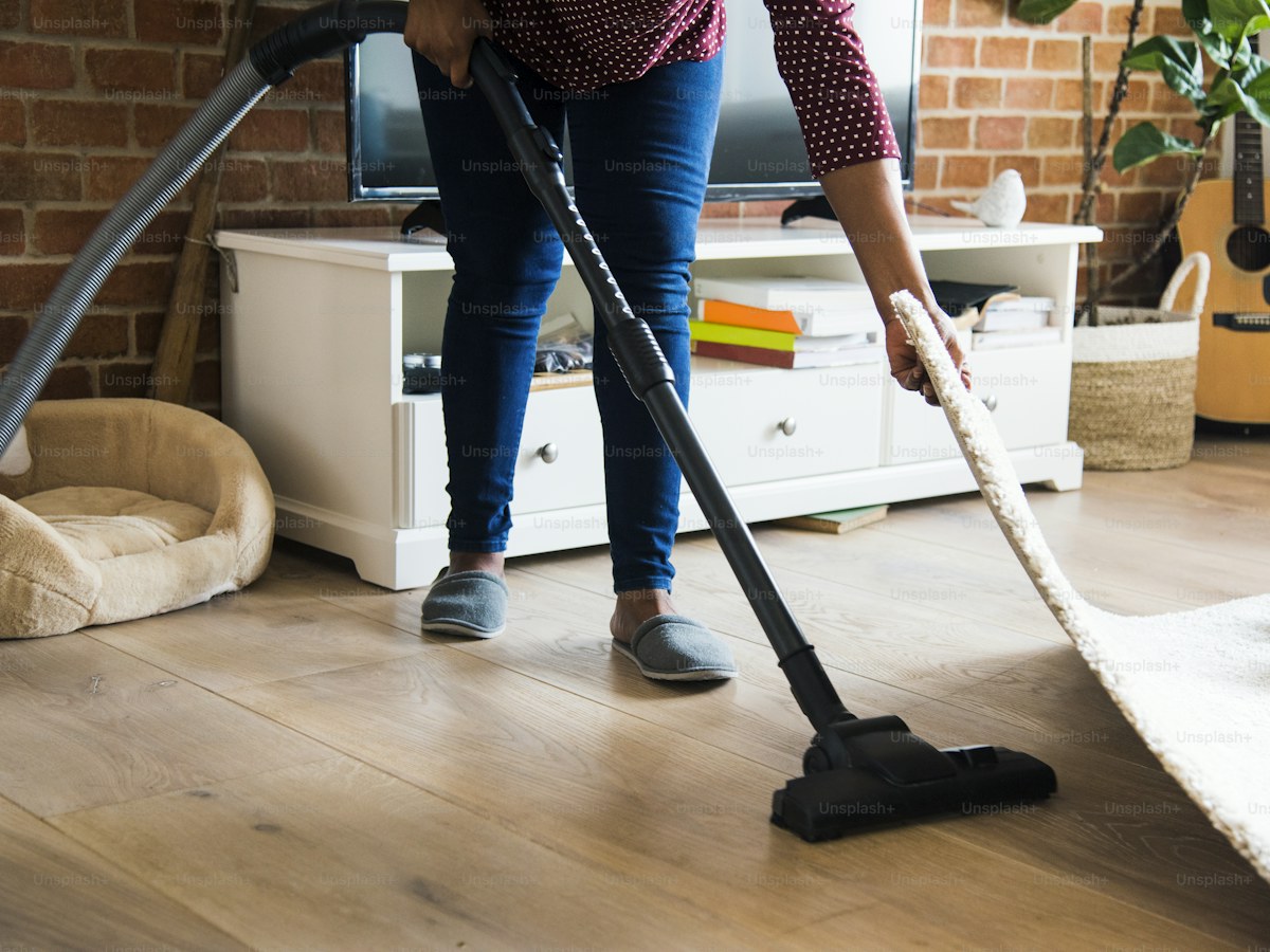 Black woman is cleaning room