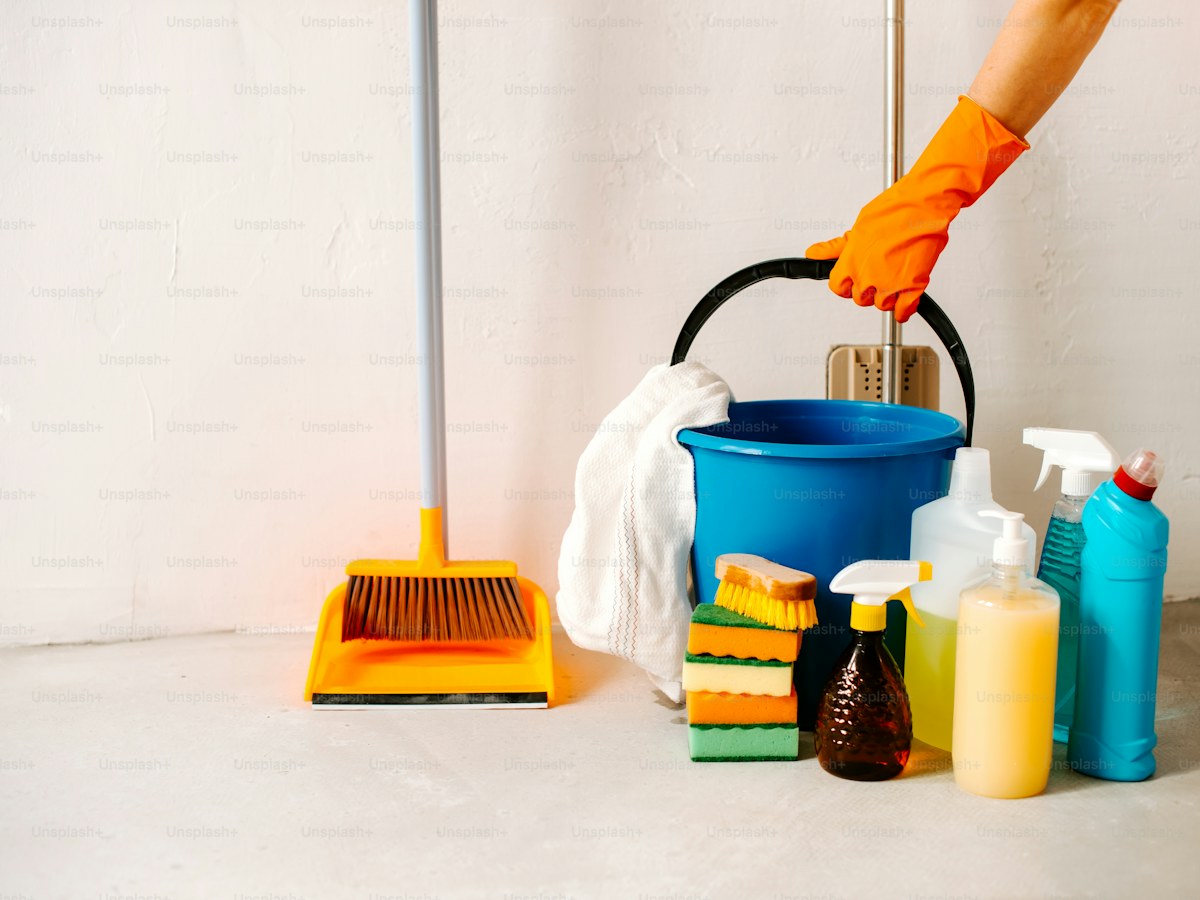 a person is cleaning the floor with a mop