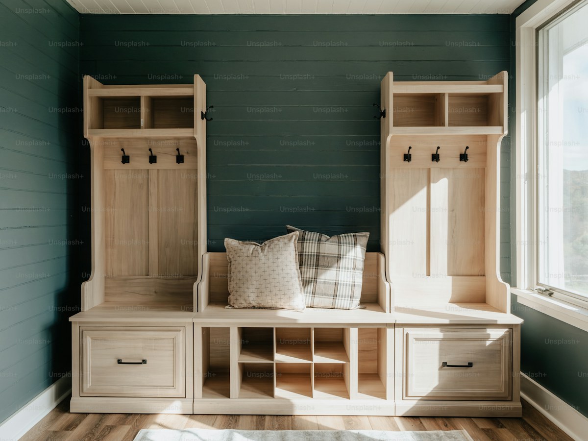 A room with a bench and a window